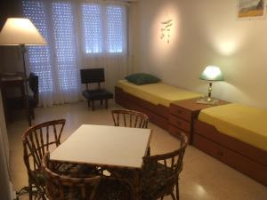 En eller flere senge i et værelse på Edificio Premier