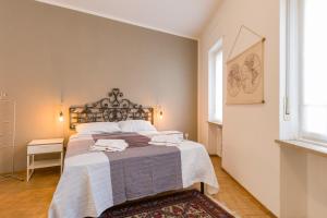 Ένα ή περισσότερα κρεβάτια σε δωμάτιο στο Residenza Le Mura