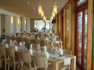 a room with a long table and chairs in it at Naturfreundehaus Bodensee in Radolfzell am Bodensee