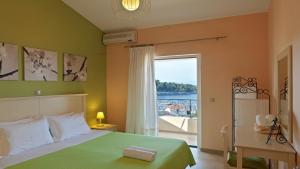 Postel nebo postele na pokoji v ubytování Elaia Boutique Apartments