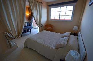Postel nebo postele na pokoji v ubytování Ferienwohnung Paraiso 2 Costa Calma Meerblick + 28 fotografií