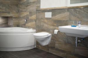 a bathroom with a toilet and a sink at Quadenhof in Düsseldorf