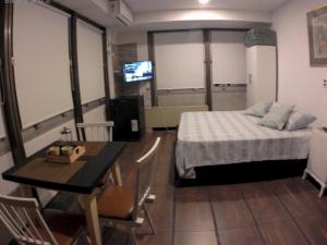 En eller flere senge i et værelse på Apartment Esmeralda 740 Microcentro Downtown Area