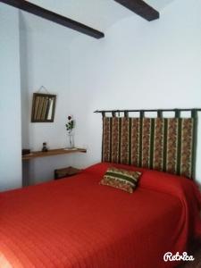מיטה או מיטות בחדר ב-Posada El Majuelo