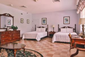 Ένα ή περισσότερα κρεβάτια σε δωμάτιο στο The Lodge at Wakulla Springs