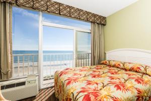 A bed or beds in a room at Maritime Beach Club by Capital Vacations