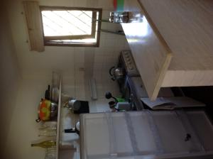 a small kitchen with a sink and a window at Coco Loco Lodge in La Paloma