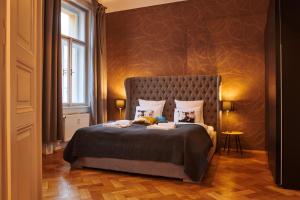 a bedroom with a large bed in a room at Royal Route Residence Lesser Town in Prague