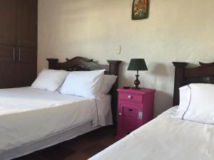 Voodi või voodid majutusasutuse Hotel Casona Las Juanas toas