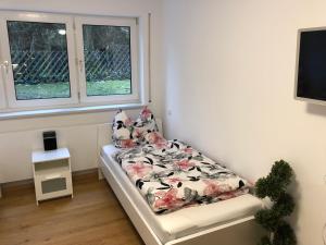 Postel nebo postele na pokoji v ubytování Apartment am Erlanger Burgberg