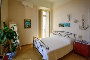 Ένα ή περισσότερα κρεβάτια σε δωμάτιο στο Appartamento Panoramico "Il Glicine"