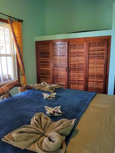 Postel nebo postele na pokoji v ubytování Slo-N-Ez Villa Terrace (Ocean View)