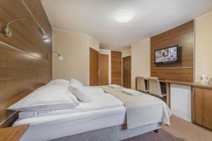 Telewizja i/lub zestaw kina domowego w obiekcie Pokoje gościnne Nord