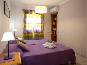 Postel nebo postele na pokoji v ubytování Apartamentos Obelisc