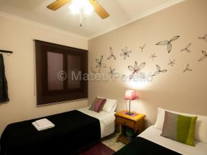 Postel nebo postele na pokoji v ubytování Apartamentos Obelisc