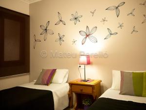 Postel nebo postele na pokoji v ubytování Apartamentos Obelisc