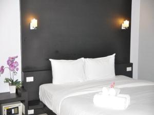 Ένα ή περισσότερα κρεβάτια σε δωμάτιο στο Khun Chaweng Resort