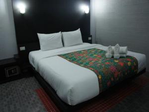 Ένα ή περισσότερα κρεβάτια σε δωμάτιο στο Khun Chaweng Resort