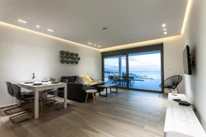 a living room with a view of the ocean at Villa Nissos in Líndos