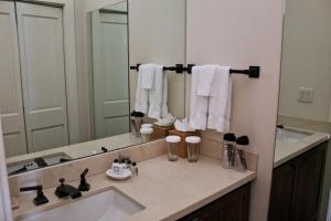 a bathroom with a sink and a large mirror at Sunnyside Resort and Lodge in Tahoe City