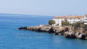 a house on a rocky island in the ocean at Fuentes de Nerja in Nerja