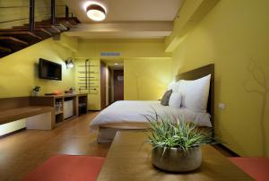 Ліжко або ліжка в номері Leofoo Resort Guanshi