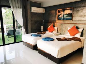 Voodi või voodid majutusasutuse In Touch Resort toas