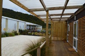 a pergola over a patio of a building at Tongariro Springs Boutique Suites in National Park