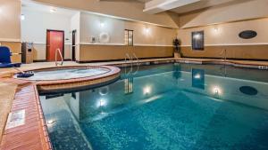 a large swimming pool in a hotel room at Best Western Jacksonville Inn in Jacksonville