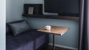 TV a/nebo společenská místnost v ubytování Nest Hotel Osaka Umeda
