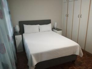 Кровать или кровати в номере Durban Penthouse