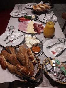 a table with plates of food on a table at Makss in Wels