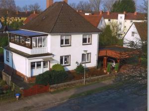 a white house with a brown roof at von Frieling in Soltau