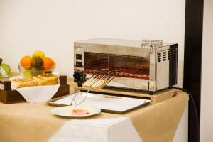 a toaster oven sitting on top of a counter at Hotel Nelson in Riccione