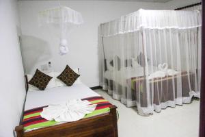 Letto o letti in una camera di Sigiriya Mana B&B