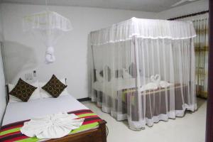 Letto o letti in una camera di Sigiriya Mana B&B