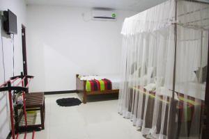 TV a/nebo společenská místnost v ubytování Sigiriya Mana B&B