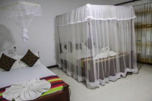 Letto o letti in una camera di Sigiriya Mana B&B