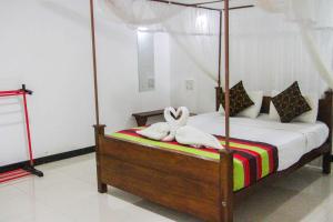 Letto o letti in una camera di Sigiriya Mana B&B