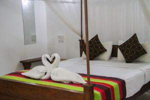Letto o letti in una camera di Sigiriya Mana B&B