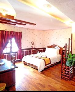 Orient Hotel Da Nang 객실 침대