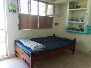 Voodi või voodid majutusasutuse ANBU RAMANA Guest House toas