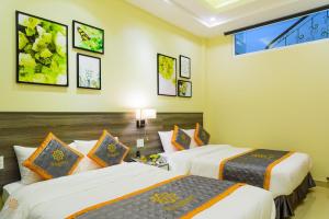 Voodi või voodid majutusasutuse VF Hotel Dalat toas