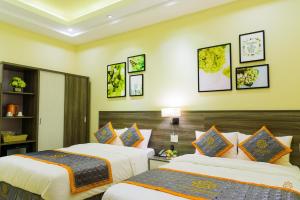 Voodi või voodid majutusasutuse VF Hotel Dalat toas