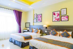 Voodi või voodid majutusasutuse VF Hotel Dalat toas