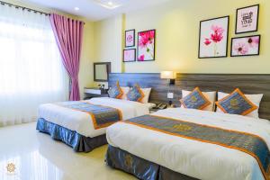 Voodi või voodid majutusasutuse VF Hotel Dalat toas