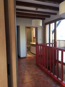 a hallway of a house with a balcony with a tub at Baketxe Baserria in Ziortza-Bolibar