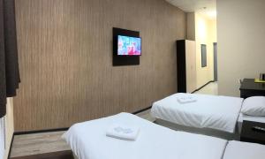 Кровать или кровати в номере Murmansk Discovery - Hotel Kompas