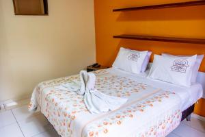 Cama ou camas em um quarto em Hotel Gramado da Serra