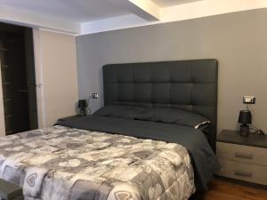 A bed or beds in a room at FORIA 58 APARTAMENTS